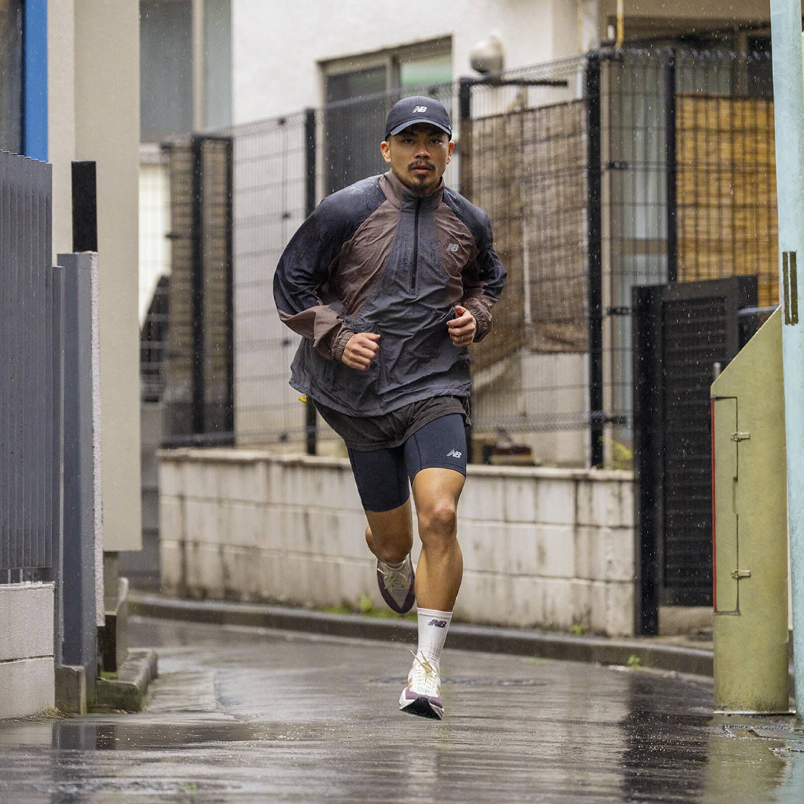 A person running towards the viewer in a city environment.