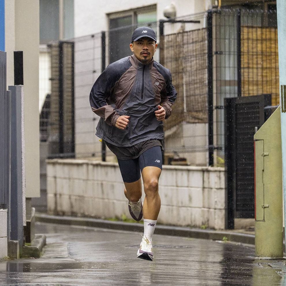 A person running towards the viewer in a city environment.