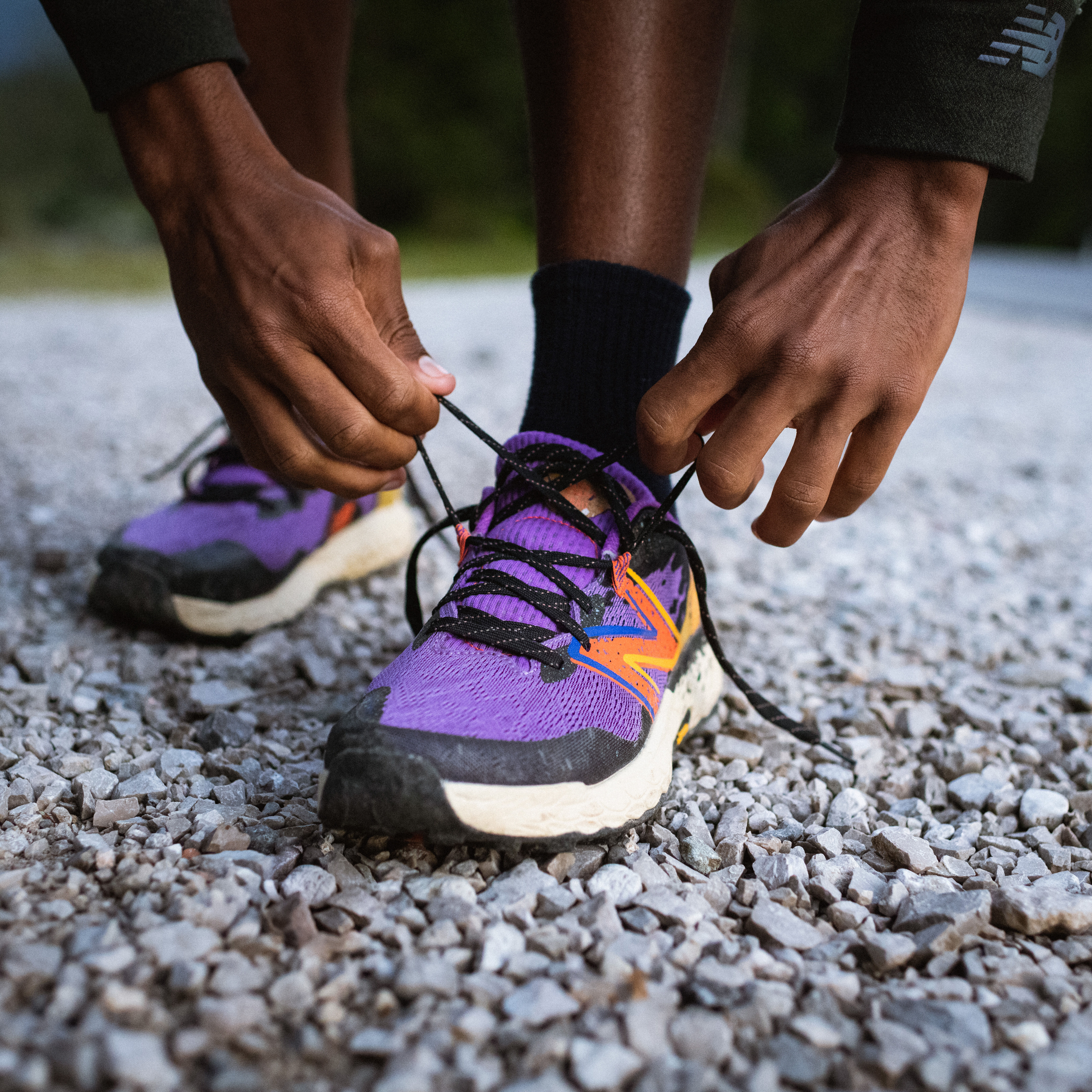 Man running in orange New Balance shoes
